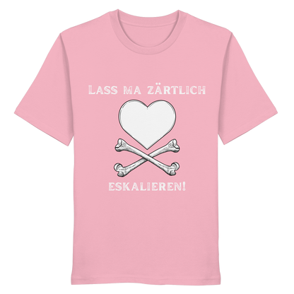 Rosa „Krawall + Zärtlichkeit Poetry Slam – Lass ma zärtlich eskalieren!“ Bio-T-Shirt von Artbookings/Shirtigo mit einem weißen Herz über gekreuzten Knochen und dem Spruch „LASS MA ZÄRTLICH ESKALIEREN!“ – inspiriert vom Poetry Slam Essen.